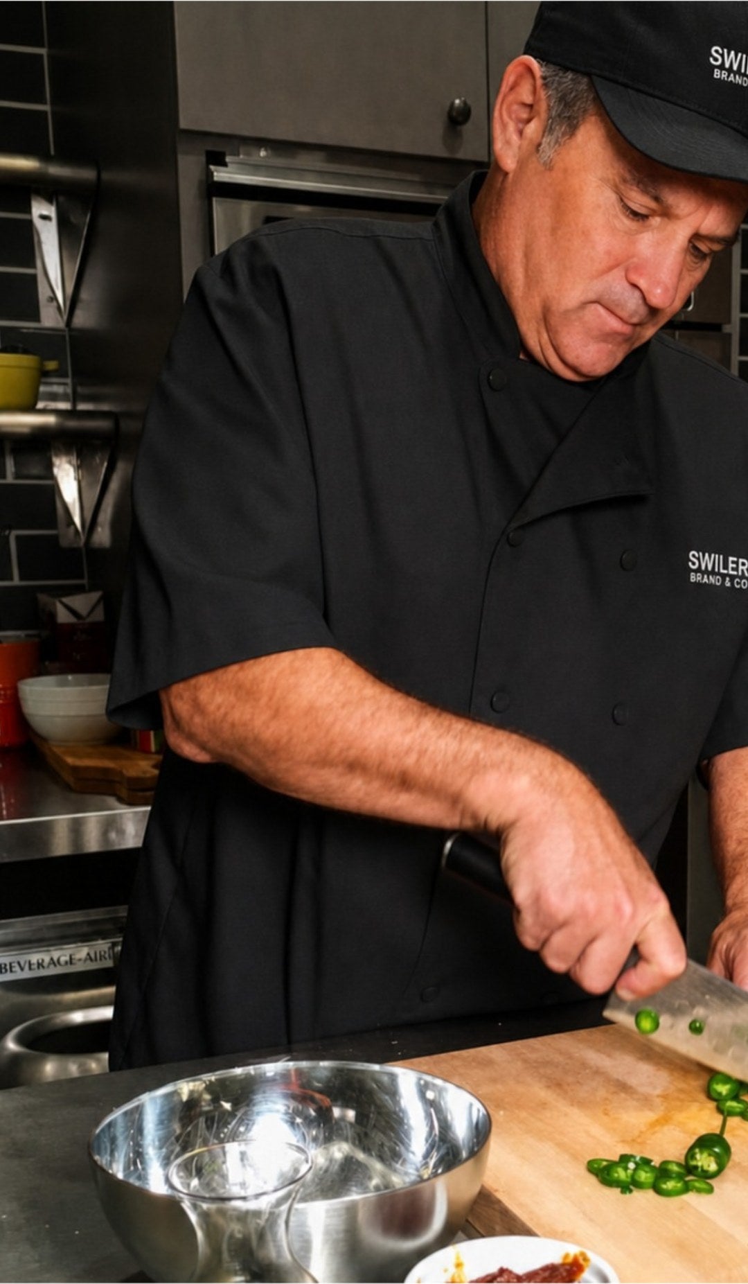 Chef Blair Swiler slicing jalapenos in the Swiler Brand kitchen